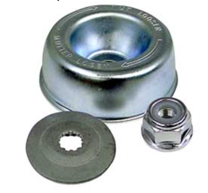 Metallic washer, disc, and nut on a white background